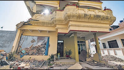 Authorities demolish the residence of activist Mohammad Javed which according to them have been constructed illegally in Prayagraj, India, Sunday, June 12, 2022. Javed has also been accused of involvement in violence during Friday’s protests against former BJP spokesperson Nupur Sharma's remark deemed derogatory to Islam’s Prophet Muhammad. (AP Photo/Rajesh Kumar Singh) (AP) Authorities demolish the residence of activist Mohammad Javed which according to them have been constructed illegally in Prayagraj, India, Sunday, June 12, 2022. Javed has also been accused of involvement in violence during Friday’s protests against former BJP spokesperson Nupur Sharma's remark deemed derogatory to Islam’s Prophet Muhammad. (AP Photo/Rajesh Kumar Singh) (AP)