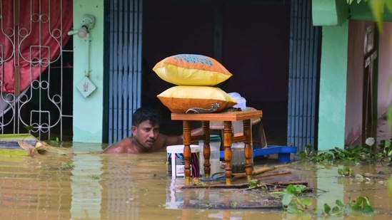 Nearly 2000 people of several villages near Barkhal area under Jagiroad assembly constituency in the central Assam district are now taking shelter on National Highway-37 in Assam's Morigaon district.(ANI)