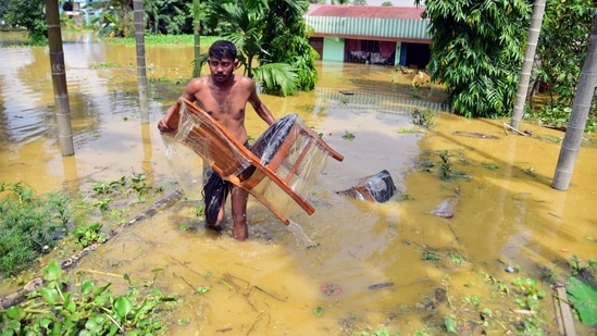 Heavy rain has disrupted normal life in several parts of the country especially the northeastern states. Situation remains grim in flood-hit parts of Assam, leaving over millions affected. Assam, one of the worst-hit areas, is set to see continuous heavy rainfall this week, according to the India Meteorological Department.(ANI)