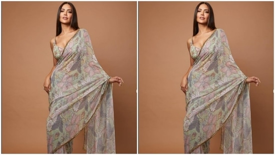 The ivory white saree featured floral details in multicolour shades. She teamed it with sleeveless blouse of the same print.(Instagram/@egupta)