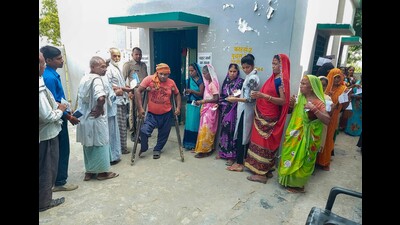 People wait in a queue to cast their votes for Azamgarh Lok Sabha by-election, at Shibli College polling station in Azamgarh, on Thursday. (PTI) People wait in a queue to cast their votes for Azamgarh Lok Sabha by-election, at Shibli College polling station in Azamgarh, on Thursday. (PTI)