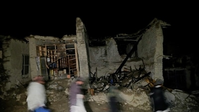 Afghans walk by a destroyed housein the village of Gyan, in Paktika province, Afghanistan. (AP Photo/Ebrahim Nooroozi) Afghans walk by a destroyed housein the village of Gyan, in Paktika province, Afghanistan. (AP Photo/Ebrahim Nooroozi)