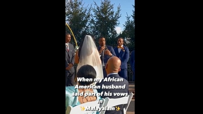 The image, taken from the Instagram video, shows the African-American groom speaking in bride’s native language Malayalam during vows (Instagram/@jenovajuliannpryor)