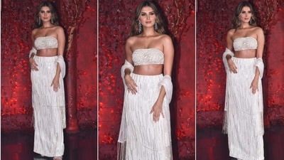 Tara Sutaria earlier attended Karan Johar's a grand 50th birthday bash in a gorgeous ivory dazzling skirt set teamed with a stole which gave her look a contemporary ethnic touch. (HT Photo/Varinder Chawla)