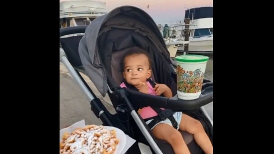 The image, taken from the viral video on Twitter, shows the kid eating funnel cake for the first time.(Screengrab)