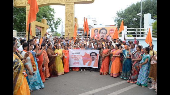 Party workers of the Pimpri-Chinchwad Shiv Sena unit organised a gathering in support of Uddhav Thackeray at Dr Babasaheb Ambedkar chowk, Pimpri on Thursday. (HT PHOTO)