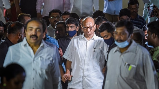 Nationalist Congress Party (NCP) chief Sharad Pawar along with party leader Jayant Patil after a party meeting in Mumbai.(PTI)