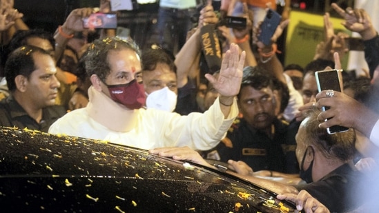 Mumbai: Maharashtra CM Uddhav Thackeray greets supporters gathered outside his private residence 'Matoshree', after leaving from his official residence 'Varsha',(PTI)