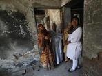 In this file photo, survivors of the 2002 Gujarat riots weep inside a house that was burnt and damaged in the 2002 riots at the Gulbarg Society,&nbsp;