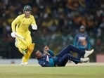 Sri Lanka's Jeffrey Vandersay, bottom, attempts unsuccessfully to field a ball as Australia's Alex Carey runs between wickets during the fifth one-day international cricket match between Australia and Sri Lanka in Colombo, Sri Lanka, Friday, June 24, 2022.(AP) Sri Lanka's Jeffrey Vandersay, bottom, attempts unsuccessfully to field a ball as Australia's Alex Carey runs between wickets during the fifth one-day international cricket match between Australia and Sri Lanka in Colombo, Sri Lanka, Friday, June 24, 2022.(AP)