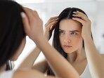 Anti-hair fall shampoos minimise breakage and reduce thinning of hair too. (Unsplash)