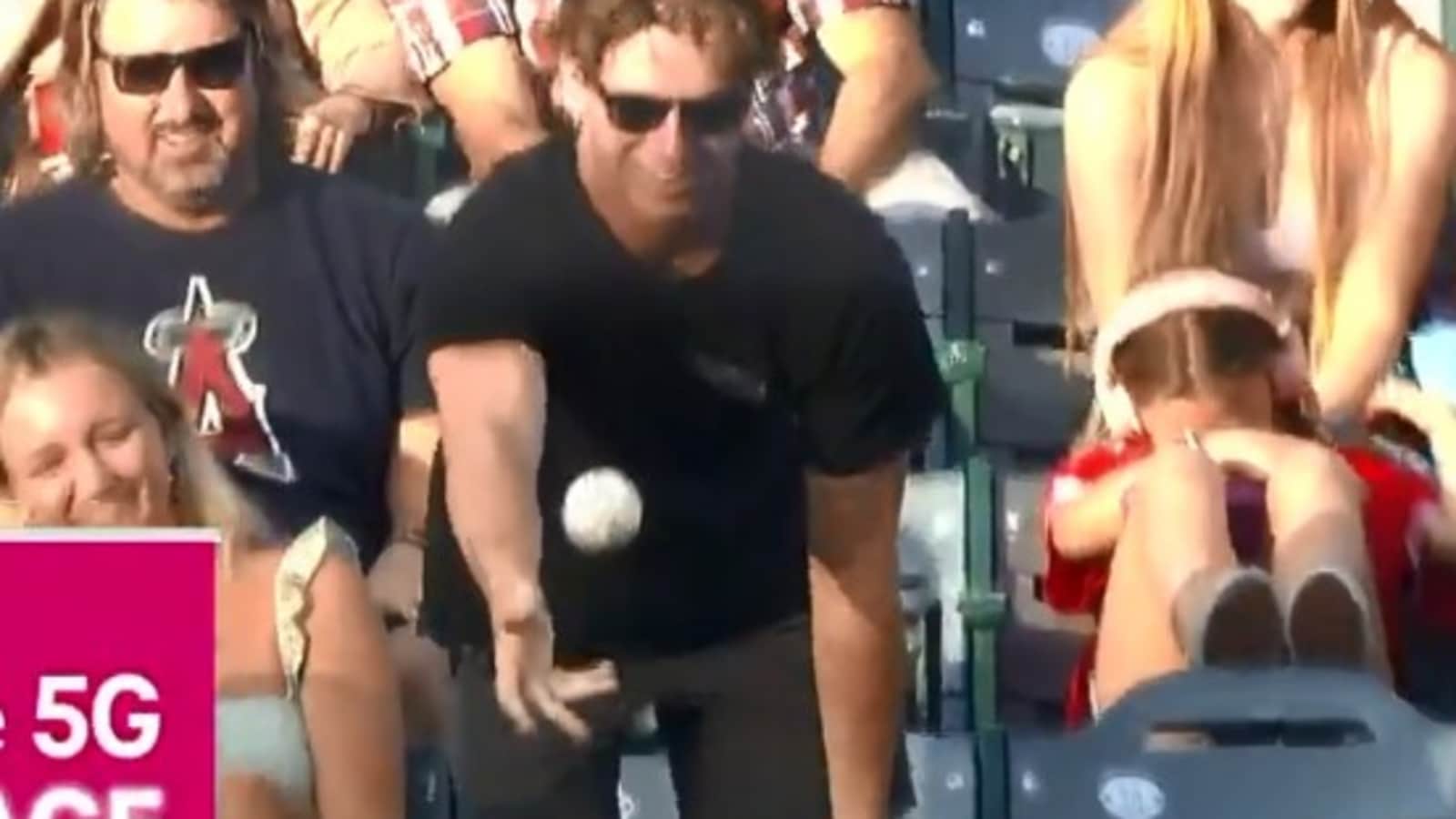 Fan catches ball at baseball game, gives it to a kid. Watch what happens next Trending
