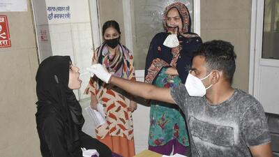 A health worker collects a nasal sample for Covid-19 test at MMG Hospital in Ghaziabad. (Sakib Ali) A health worker collects a nasal sample for Covid-19 test at MMG Hospital in Ghaziabad. (Sakib Ali)