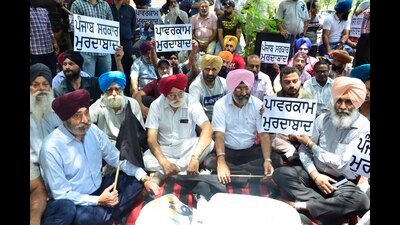 Industrialists protesting against the PSPCL and the Punjab government at the Janta Nagar power sub-station in Ludhiana on Friday. (Harvinder Singh/HT)