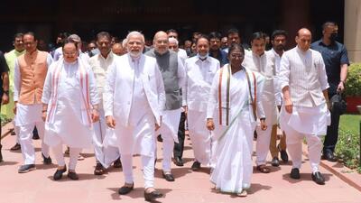 NDA's candidate Droupadi Murmu, accompanied by Prime Minister Narendra Modi, Union Ministers Rajnath Singh, Amit Shah, BJP president JP Nadda and others walk towards Parliament House to file her nomination papers for the Presidential polls in New Delhi on Friday. (TWITTER.) NDA's candidate Droupadi Murmu, accompanied by Prime Minister Narendra Modi, Union Ministers Rajnath Singh, Amit Shah, BJP president JP Nadda and others walk towards Parliament House to file her nomination papers for the Presidential polls in New Delhi on Friday. (TWITTER.)