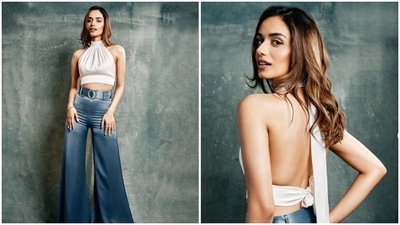 Manushi Chhillar earlier set the internet ablaze with her trendy summer outfit comprised of a white halter crop top and high-rise flared pants. (Instagram/@manushi_chhillar)