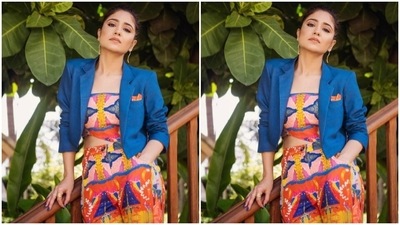 Shweta layered her look with a cropped blue blazer. For footwear, she opted for yellow stilettos. (Instagram/@battatawada)