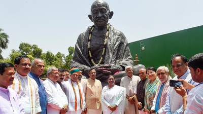 Before filing nominations, Droupadi Murmu pays tribute to Mahatma Gandhi at Parliament House. (PTI) Before filing nominations, Droupadi Murmu pays tribute to Mahatma Gandhi at Parliament House. (PTI)