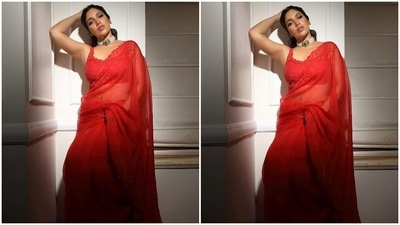 Bhumi picked minimal accessories to style the red six yards. She opted for a pearl and gold adorned choker necklace decked with an emerald stone on the front and gold strappy heels. (Instagram) Bhumi picked minimal accessories to style the red six yards. She opted for a pearl and gold adorned choker necklace decked with an emerald stone on the front and gold strappy heels. (Instagram)
