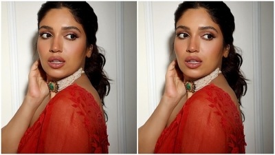 Bhumi added a touch of glam to the Raksha Bandhan trailer launch with her red organza saree. The see-through drape comes decked with a stunning sheen and floral applique work on the borders. (Instagram) Bhumi added a touch of glam to the Raksha Bandhan trailer launch with her red organza saree. The see-through drape comes decked with a stunning sheen and floral applique work on the borders. (Instagram)