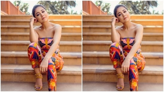Shweta decked up in an off-shoulder cropped top featuring quirky patterns in shades of pink, yellow, blue and orange. She paired it with a pair of trousers of the same print.(Instagram/@battatawada)