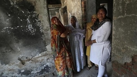 In this file photo, survivors of the 2002 Gujarat riots weep inside a house that was burnt and damaged in the 2002 riots at the Gulbarg Society,&nbsp;(Reuters)
