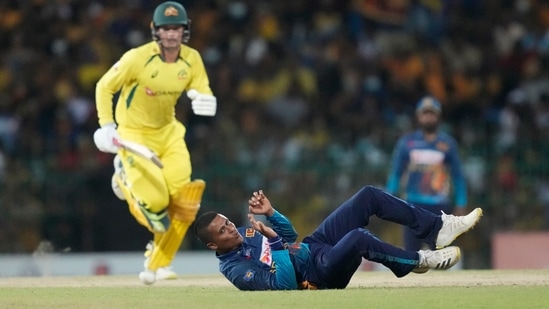 Sri Lanka's Jeffrey Vandersay, bottom, attempts unsuccessfully to field a ball as Australia's Alex Carey runs between wickets during the fifth one-day international cricket match between Australia and Sri Lanka in Colombo, Sri Lanka, Friday, June 24, 2022.(AP) Sri Lanka's Jeffrey Vandersay, bottom, attempts unsuccessfully to field a ball as Australia's Alex Carey runs between wickets during the fifth one-day international cricket match between Australia and Sri Lanka in Colombo, Sri Lanka, Friday, June 24, 2022.(AP)