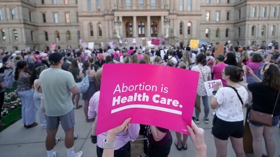 Abortion-rights protesters attend a rally following the United States Supreme Court's decision to overturn Roe v. Wade, federally protected right to abortion, outside the state capitol.(AP)