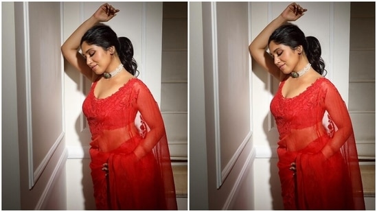 Bhumi draped the saree around her body in the traditional style, accentuating her enviable curves. A sleeveless blouse featuring a plunging neckline and back, sheer overlay, floral applique work matching the saree borders, cropped hem, and a fitted silhouette completed the traditional outfit.(Instagram)