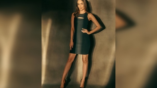 Manushi Chhillar made jaws drop as she stepped out wearing a timeless short black cut-out sleeveless dress.(Instagram/@manushi_chhillar)