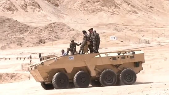 Northern Army Commander Lt General Upendra Dwivedi drives the Made in India Infantry Combat Vehicle in Leh.(ANI)