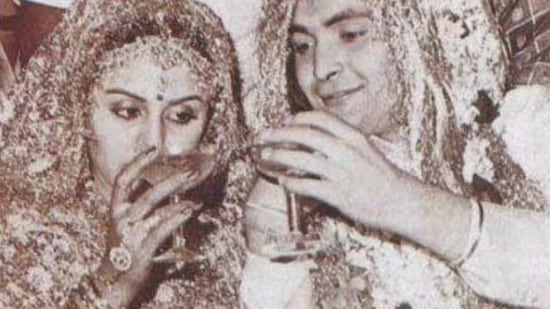 Neetu Kapoor and Rishi Kapoor having a drink at their wedding.