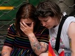 People react at the scene of a shooting in central Oslo, Norway.(AP) People react at the scene of a shooting in central Oslo, Norway.(AP)