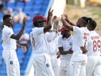 West Indies players celebrate a dismissal. West Indies players celebrate a dismissal.
