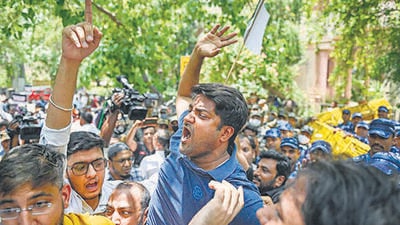 Youth Congress members protest outside the CPI(M) headquarters in New Delhi on Saturday over vandalisation of Rahul Gandhi’s office in Wayanad. (PTI) Youth Congress members protest outside the CPI(M) headquarters in New Delhi on Saturday over vandalisation of Rahul Gandhi’s office in Wayanad. (PTI)
