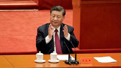 Chinese President Xi Jinping applauds at a meeting commending role models of the Beijing 2022 Olympic and Paralympic Winter Games, at the Great Hall of the People in Beijing on April 8, 2022. (REUTERS)