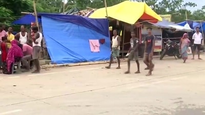 Residents staying in makeshift tents on highways in flood-hit Assam. Residents staying in makeshift tents on highways in flood-hit Assam. 