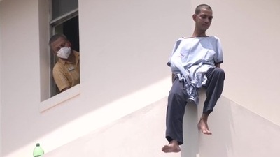 A patient climbed and sat on the window pane of a high rise hospital building in Kolkata.