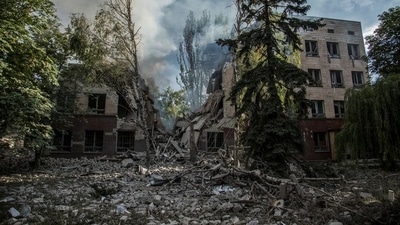 A smoke rises over remains of a building destroyed by a military strike, as Russia's attack on Ukraine continues, in Lysychansk, Luhansk region. (REUTERS)