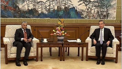 Chinese Foreign Minister Wang Yi wirth Indian ambassador to China Pradeep Kumar Rawat. Chinese Foreign Minister Wang Yi wirth Indian ambassador to China Pradeep Kumar Rawat.