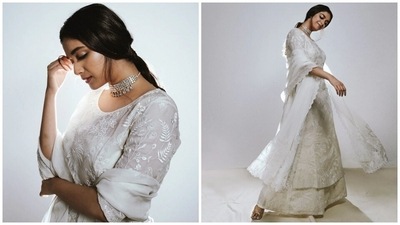 Meanwhile, the appliqué patchwork detailing on the suit set depicts swaying trees and flights of flamingos, making it a perfect pick for summers to beat the heat in style. You can take inspiration from Keerthy to upgrade your wardrobe with a similar ivory suit set and style it with maximalist accessories and makeup. (Instagram) Meanwhile, the appliqué patchwork detailing on the suit set depicts swaying trees and flights of flamingos, making it a perfect pick for summers to beat the heat in style. You can take inspiration from Keerthy to upgrade your wardrobe with a similar ivory suit set and style it with maximalist accessories and makeup. (Instagram)