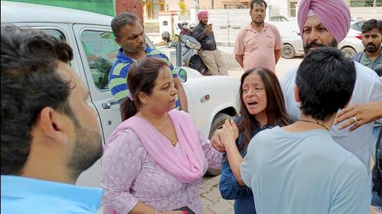 Family members mourn the death of Kartik Popli, son of arrested IAS officer Sanjay Popli, in Chandigarh on Saturday. (PTI) Family members mourn the death of Kartik Popli, son of arrested IAS officer Sanjay Popli, in Chandigarh on Saturday. (PTI)