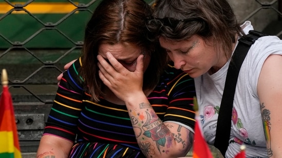 People react at the scene of a shooting in central Oslo, Norway.(AP)