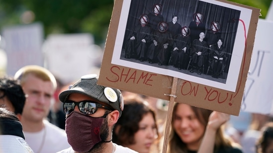 An abortion-rights protester looks on during rally, on June 24, 2022, in Des Moines, Iowa.