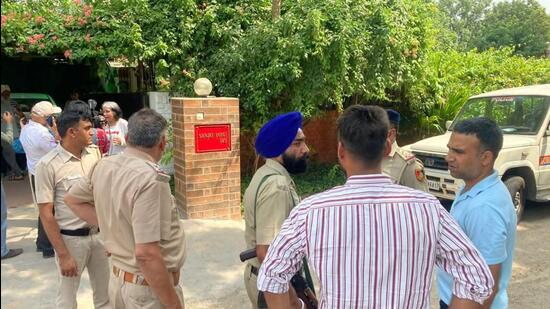 Police personnel outside the house of Punjab IAS officer Sanjay Popli in Chandigarh on Saturday after his son, Kartik, died of a gunshot wound in the head. (HT Photo) Police personnel outside the house of Punjab IAS officer Sanjay Popli in Chandigarh on Saturday after his son, Kartik, died of a gunshot wound in the head. (HT Photo)