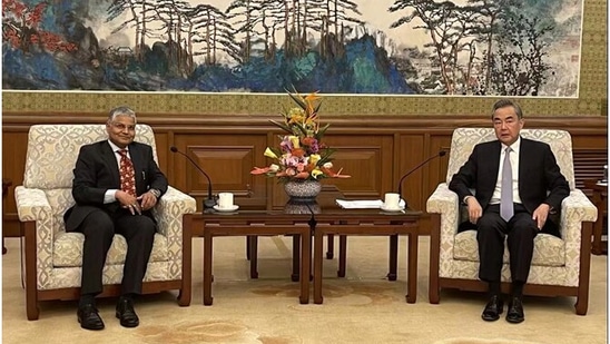 Chinese Foreign Minister Wang Yi wirth Indian ambassador to China Pradeep Kumar Rawat. Chinese Foreign Minister Wang Yi wirth Indian ambassador to China Pradeep Kumar Rawat.