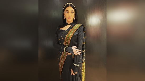 Shruti Haasan wore a black traditional pat silk saree that Assam is famous for and teamed it with a cut-out full-sleeved blouse.(Instagram/@shrutzhaasan)