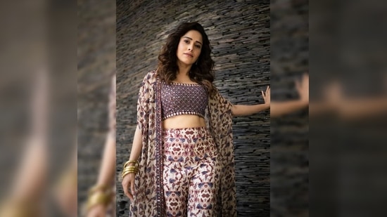 Nushrratt Bharuccha elevated her look with thick gold bangles and statement earrings.(Instagram/@nushrrattbharuccha)