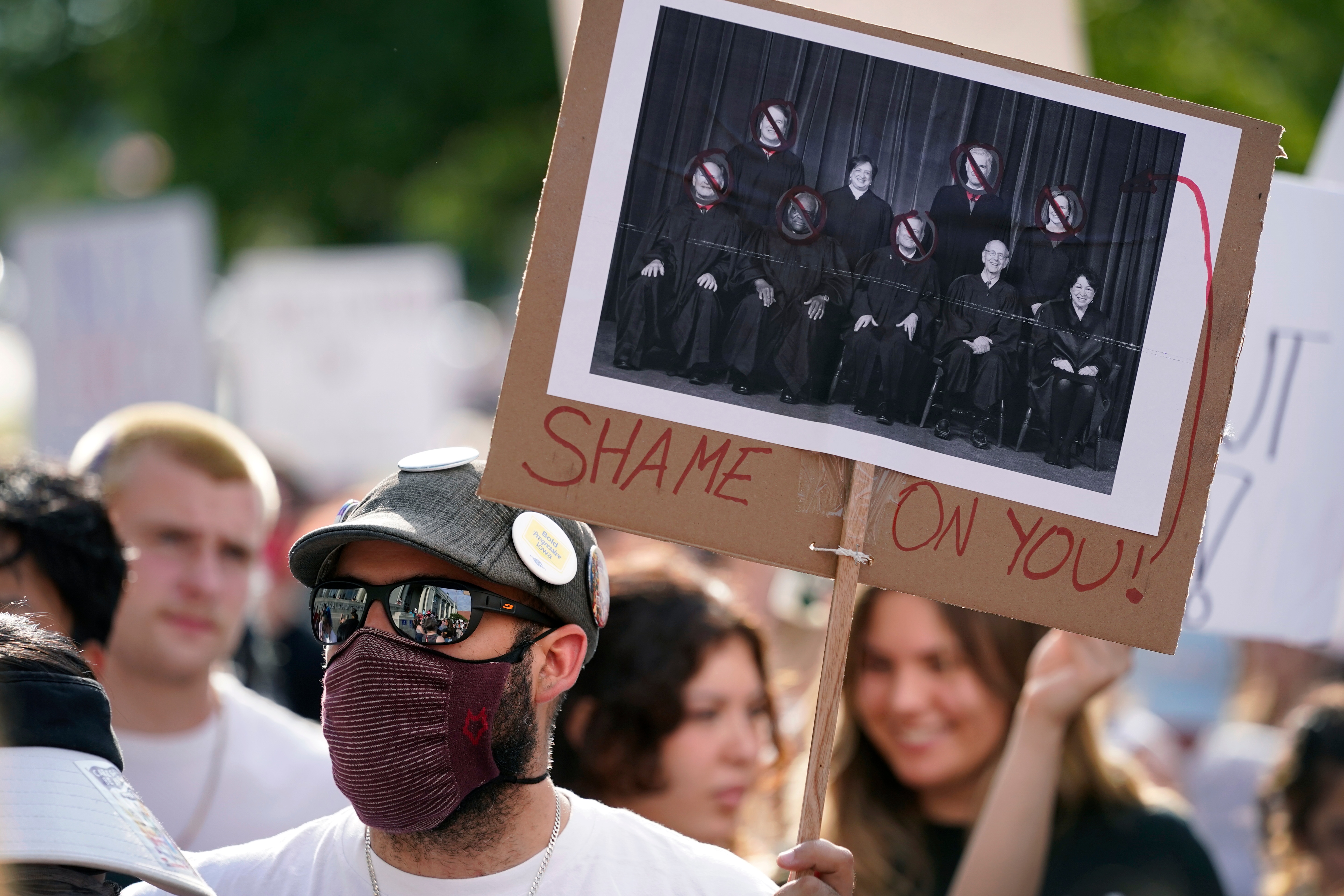 An abortion-rights protester looks on during rally, on June 24, 2022, in Des Moines, Iowa. (AP) An abortion-rights protester looks on during rally, on June 24, 2022, in Des Moines, Iowa. (AP)