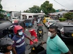 People wait in a long queues to buy fuel for their vehicles at a filling station in Colombo, Sri Lanka.(AP) People wait in a long queues to buy fuel for their vehicles at a filling station in Colombo, Sri Lanka.(AP)